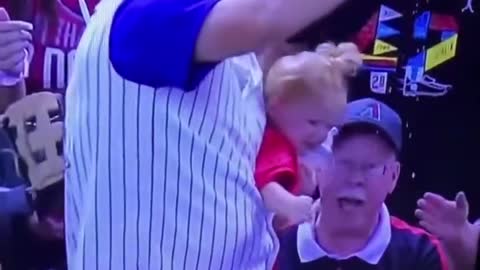 He caught the ball, didn't drop the child and didn't spill the beer