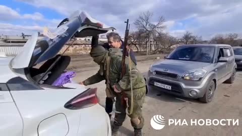 The DPR military checks men leaving Mariupol for signs of participation in the battles.