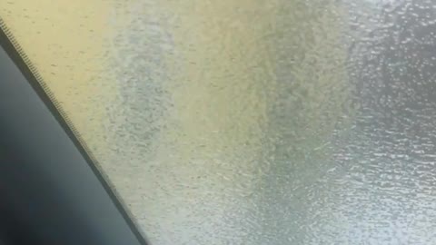 Ice Storm Creates Solid Layer of Ice on Car