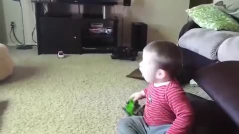 see the funny video of the boy gawking because he saw a toy car