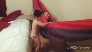 Red black hammock in bedroom falls