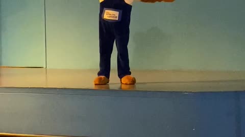 Funny cute teddy bear dancing on stage