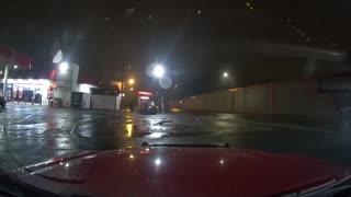 Red Light Runner Nearly Causes Accident on Wet Roads