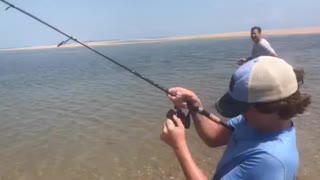 Kid catches fish