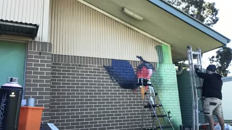 Artist Paints Beautiful Hyper-Realistic Rainbow Lorikeet Mural