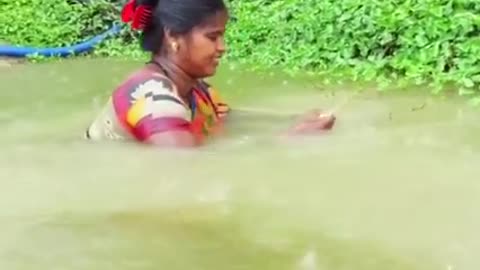 How girls catch fish in the village during monsoon floods