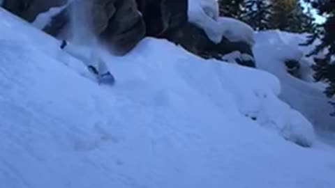 Guy blue jacket skiing fall off cliff