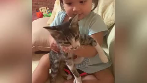 baby girl and her kitten