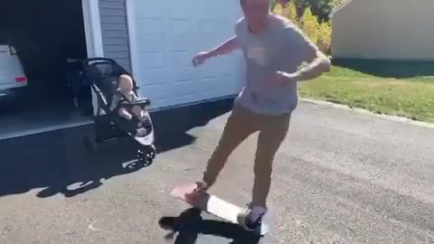 Toddler's priceless reaction to dad's awesome skateboard skills