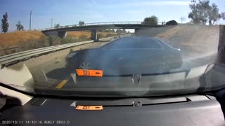 Overtaking Car Crashes into Barrier