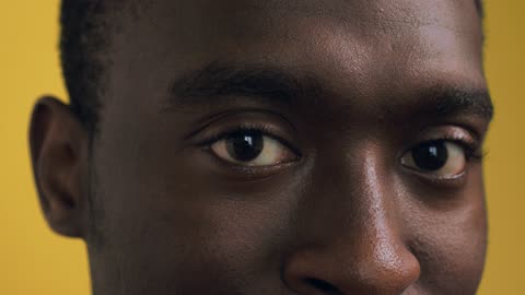 An Extreme Close up of a Man Raising an Eyebrow