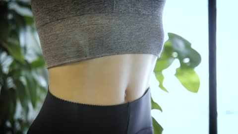 Woman stretching arms doing yoga