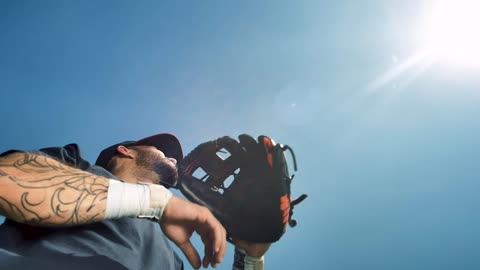 Baseball player catches and throws a ball