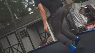 Slow motion guy front flip fail trampoline