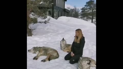 The woman and the wolves howl together