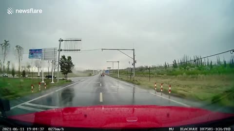 Motorist's dashcam captures intense lightning strike nearby road in China