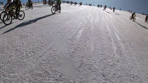 Man Dodges Hundreds of Bikers on Snowy Mountain