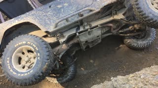 2.5 YJ Jeep trying hard hill climbing off camber