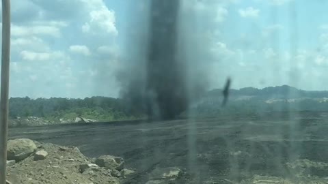 Dust Devil Creeps Across Coal Mine