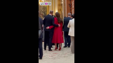 Kate and William put their hands around each other in a rare PDA during Buckingham