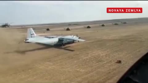 The take off & landing of Russian An-12 on dirt runway with Mi-24 escort in Libya Base