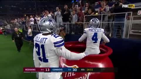 Dallas Cowboys running back Ezekiel Elliott tosses QB into bucket