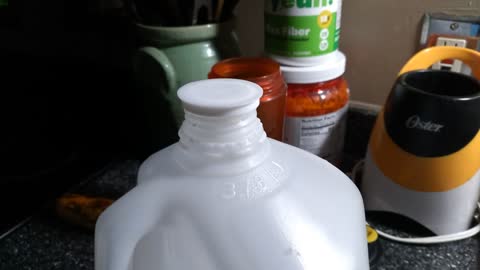 Milk jug lid repeatedly popping on its own