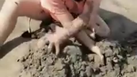 Child playing with sand