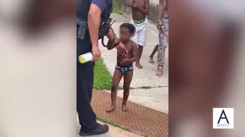 Young children in Minneapolis hit and shout profanities at police officers