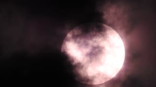 sun close up through clouds