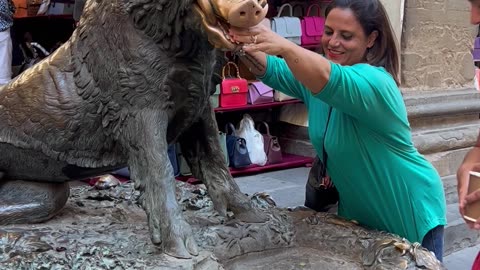 Woman Picks Up Coin That Was Just Thrown in the Fountain