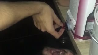 Guy drinks from nozzle sprays face