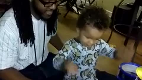 Toddler Learning The Drums Hits Dad In The Face With Drum Stick