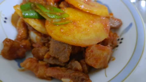 Stir-fried pork with red pepper paste.