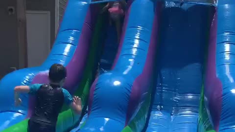 Grandma slides down waterslide