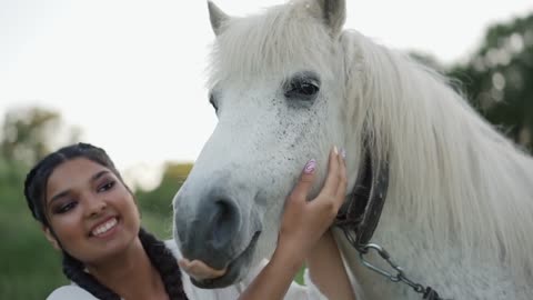 A Horse Licking a Woman's Face
