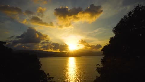 Gorgeous Time Lapse Video Of Sunset Clouds Hovering Over Water