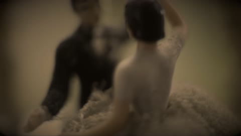 Image Of A Dancing Newlywed Couple Represented In A Music Box Toy