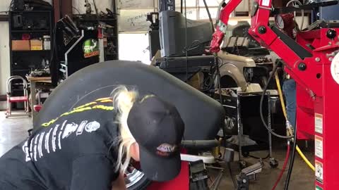 Girl Performing a Reverse Mount at the Shop