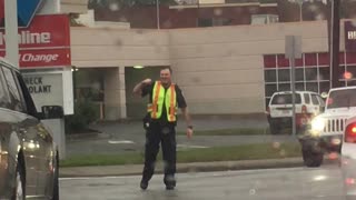 Cop Directs Traffic to the Beat