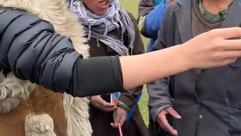 Lady gives books gift to Afghani students