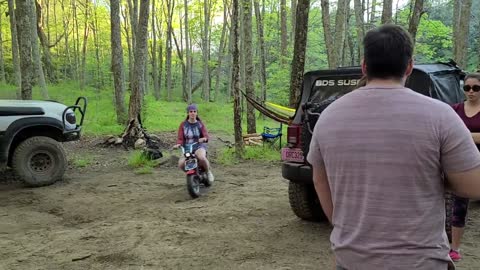 Lexy riding the Honda Z50 and Matt on his bike, campout in CT