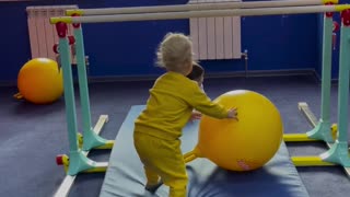 Kids are playing with colorful balls 🏀