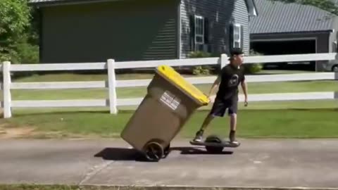 Boy uses electric skateboard to take out trash