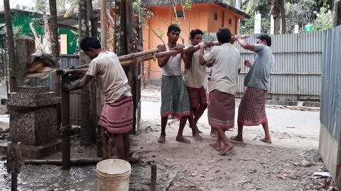 Villagers digging with Cows dung and water for deep Tube well