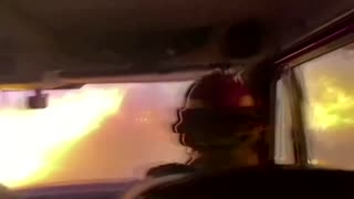 Firefighters drive through raging Tamarack wildfire