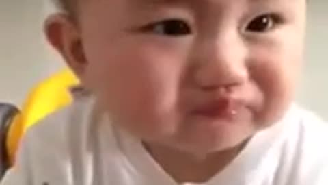 Baby eating lemon for the first time