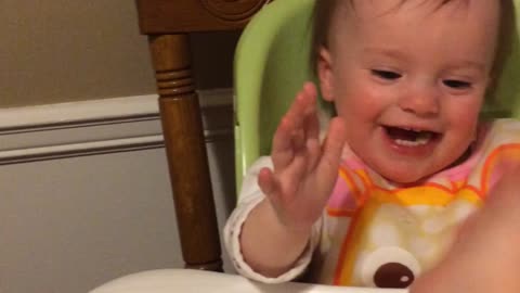 Baby gives high fives