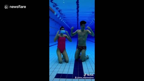 Artistic swimming duo perform