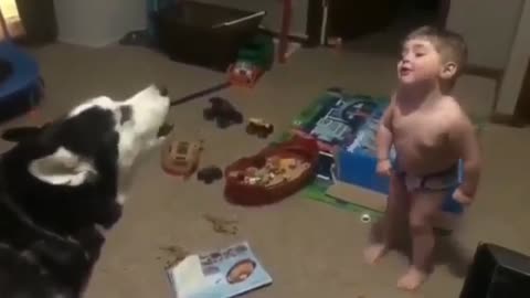 BABY HOWLING WITH DOG IT IS VERY CUTE AND FUNNY!!